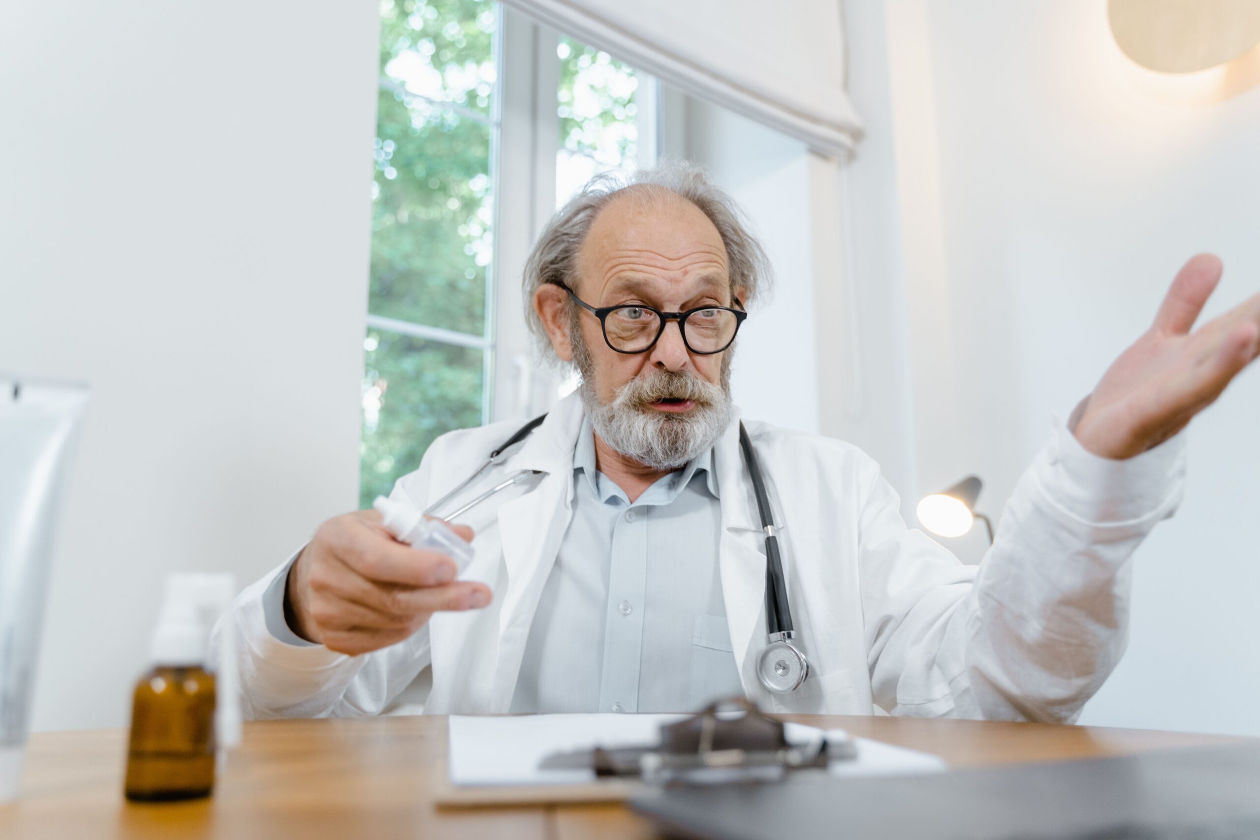 Older adult discussing semaglutide treatment with a healthcare professional, representing research into GLP-1 medicines and healthy aging.