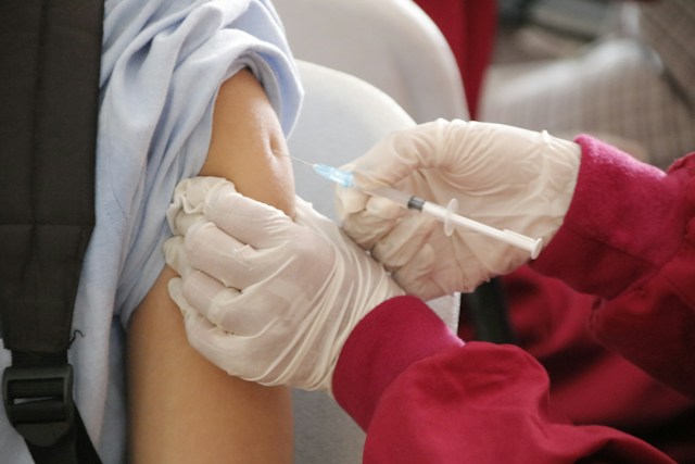 Young boy receiving an HPV vaccination as part of cancer prevention efforts