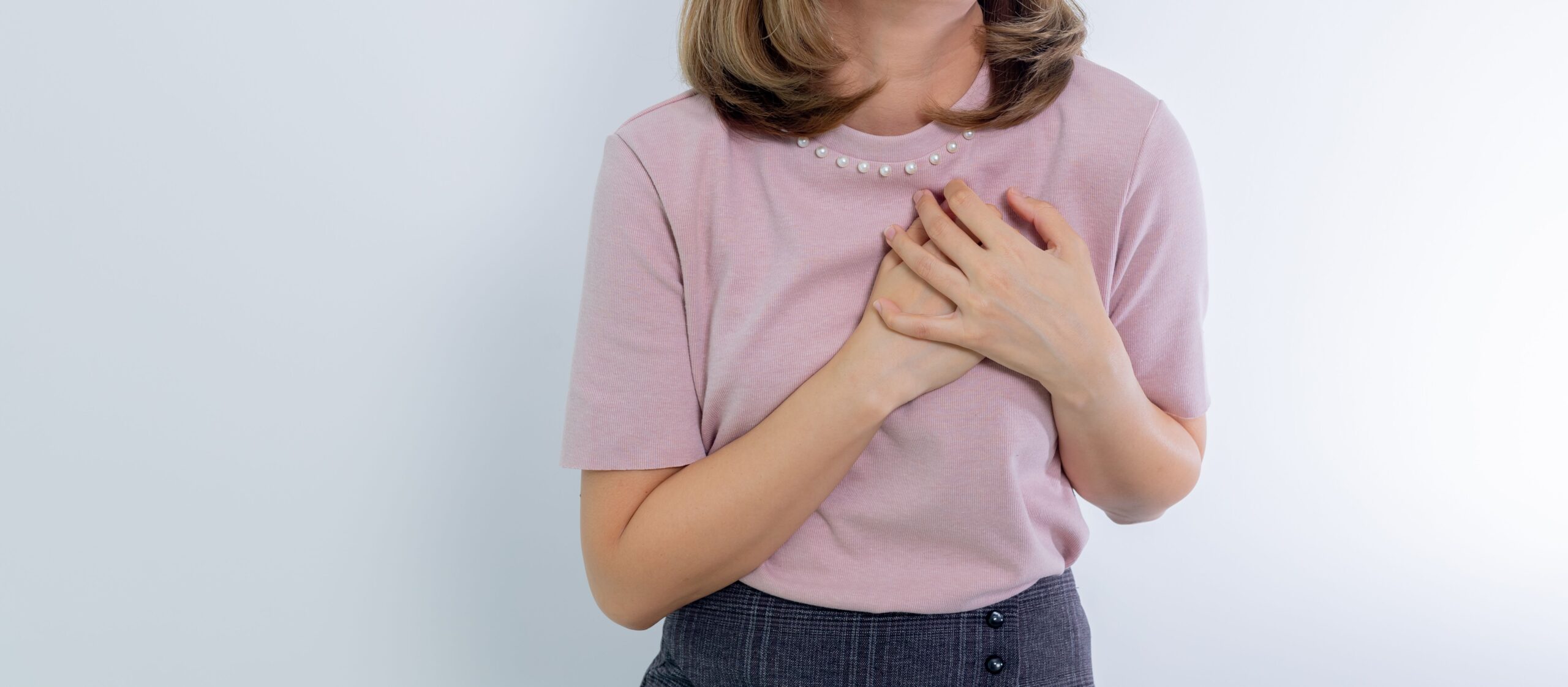 Older woman discussing heart health warning signs with a doctor during a medical appointment