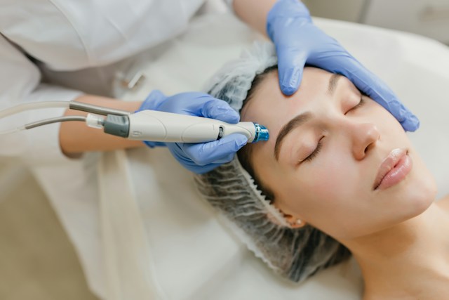 Dermatologist examining an older patient's skin during a routine medical consultation