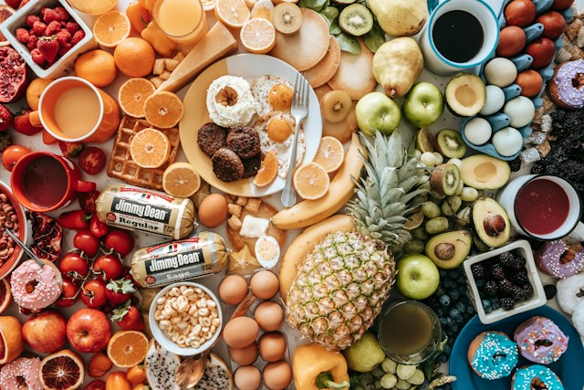 Older adult enjoying a balanced meal with vegetables, whole grains and a protein-rich food